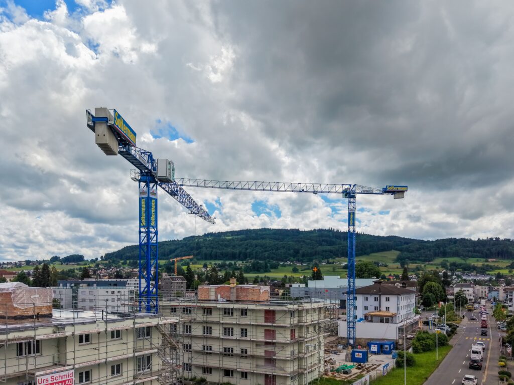 Raimondi MRT159 flat-top tower cranes onsite in Switzerland for Interkran